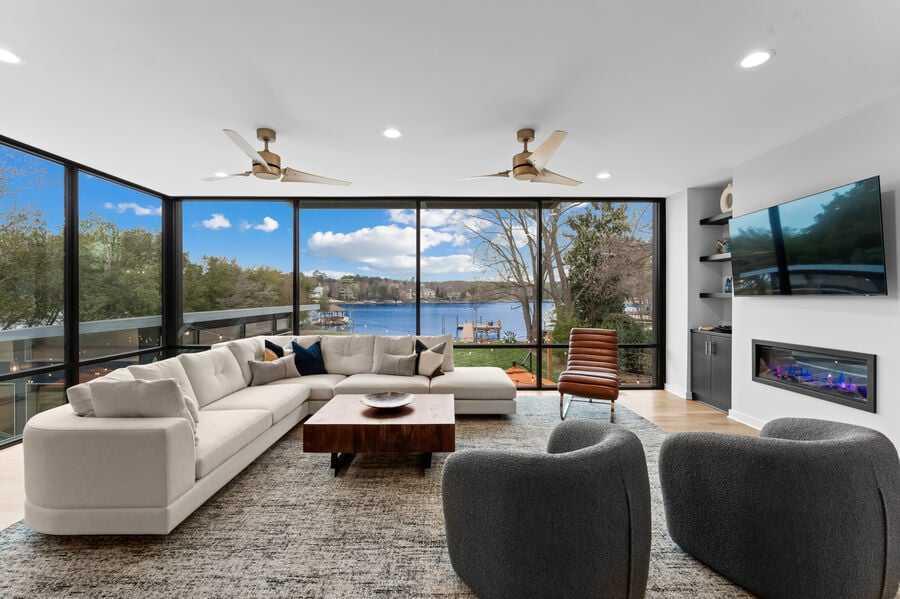 Floor to ceiling windows give this StayLakeNorman lakefront property a luxurious New York loft vibe. 