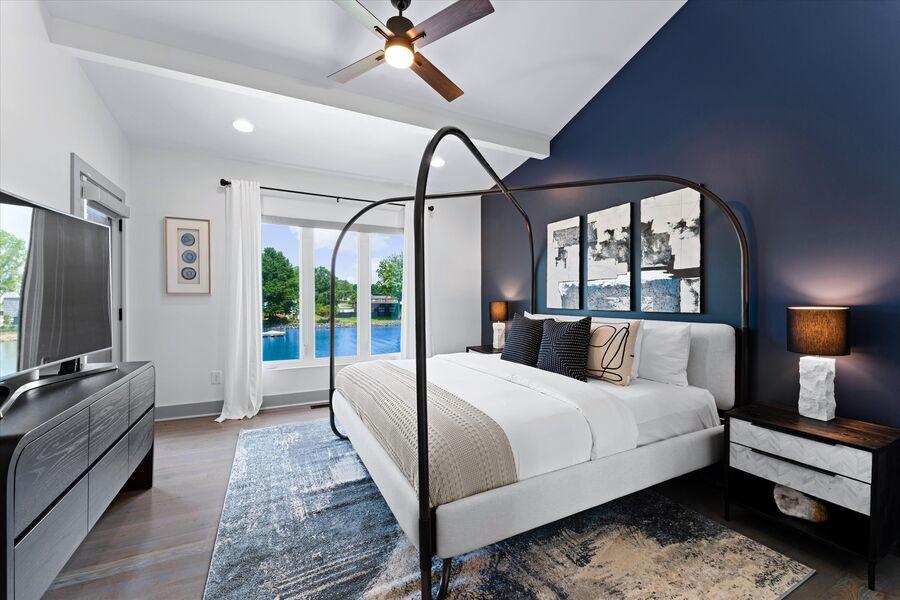 Cozy meets upscale design in the primary bedroom of StayLakeNorman vacation rental, Elysian Shores. 