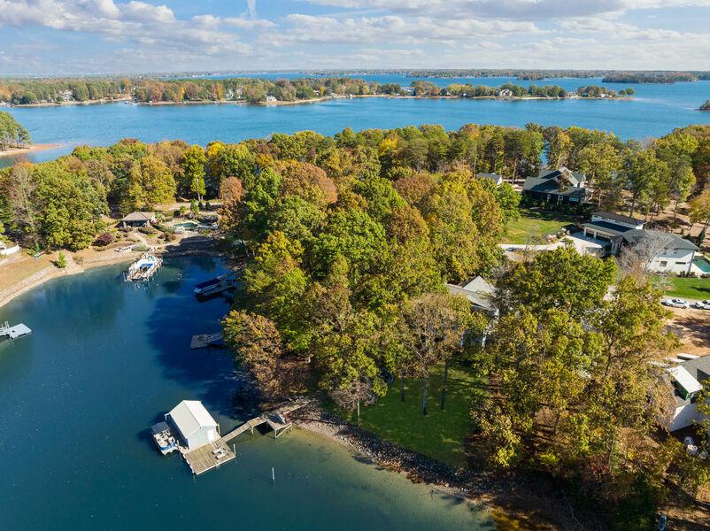 Ariel views of Lake Norman, NC in the fall with trees changing colors.