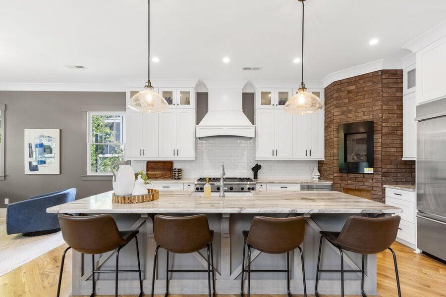 luxury amenities including fully stocked kitchen with electric fireplace