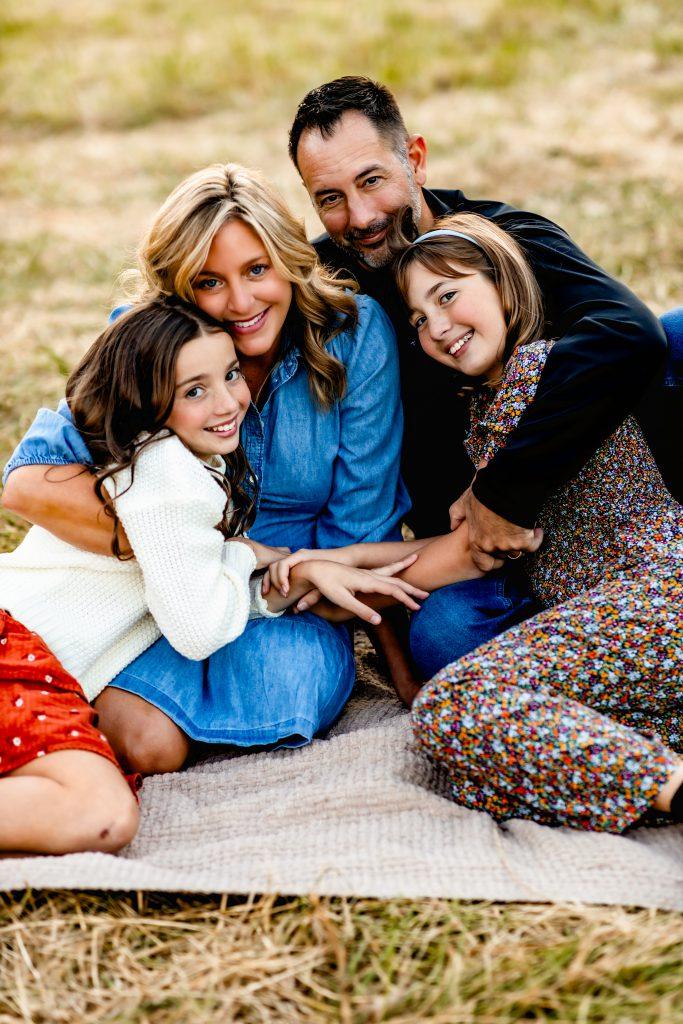 Owners and designers behind StayLakeNorman luxury vacation rental, Hogan Crest, are Rob and Missy with their daughters. 