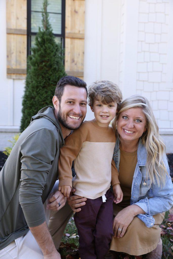 Owners and designers behind StayLakeNorman luxury vacation rental, Hogan Crest, are Drew and Stephanie with their son. 
