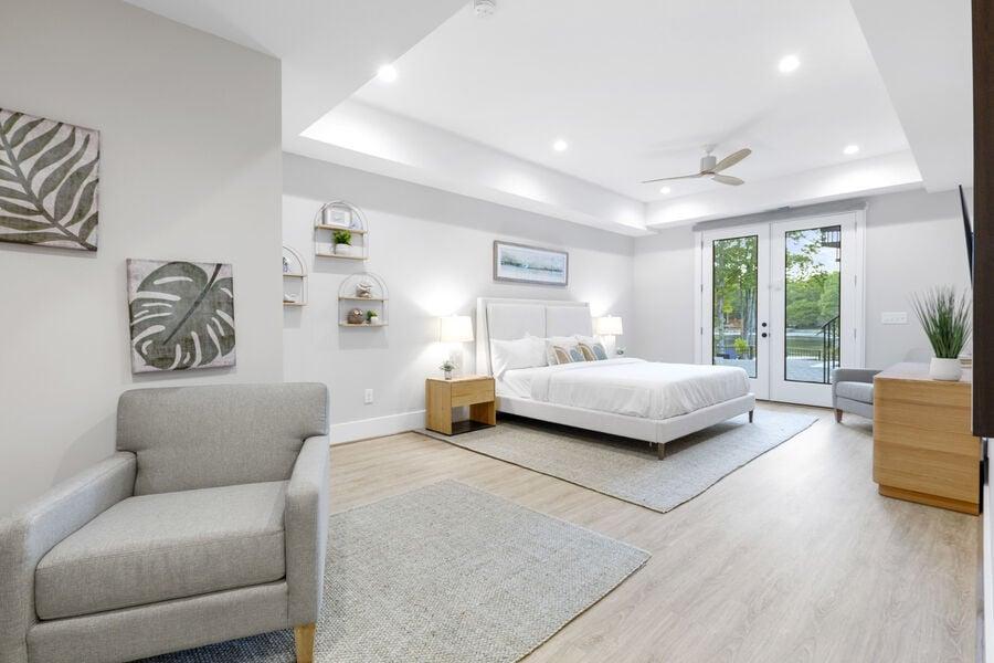 large primary suite with pool walk-out access