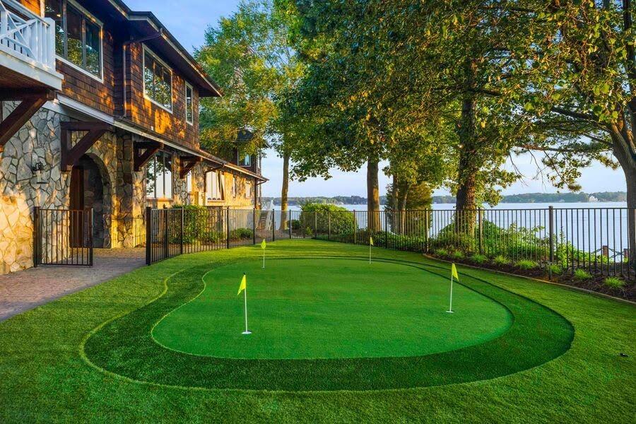 Waterfront putting green at Chasestone Peninsula, a StayLakeNorman Luxury Vacation Rental in Lake Norman, NC.